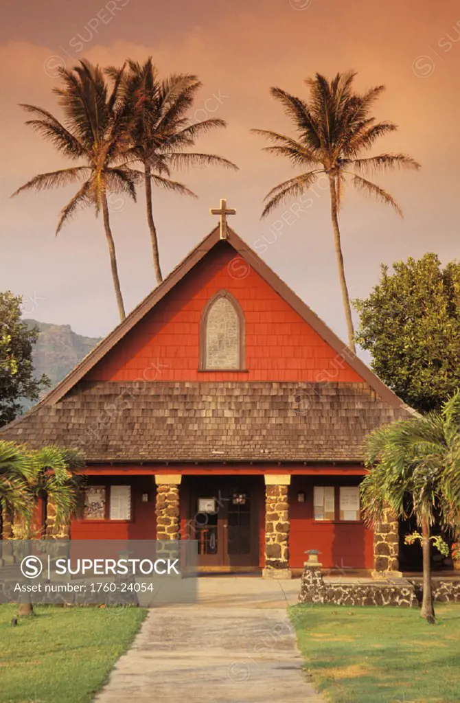 Hawaii, Kauai, North Shore, front view of church with tall palm trees background.