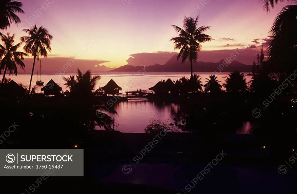 French Polynesia, Papeete, Tahiti Beachcomber Hotel silhouetted at sunset