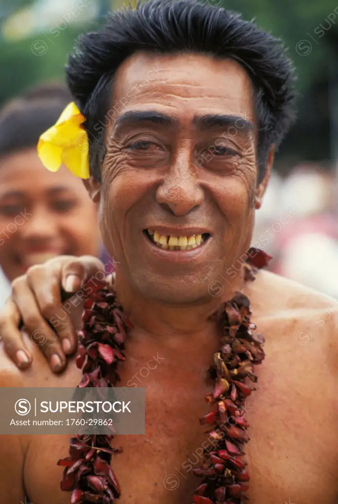 Samoa, Portrait of older samoan man smiling with flower in ear NO MODEL RELEASE