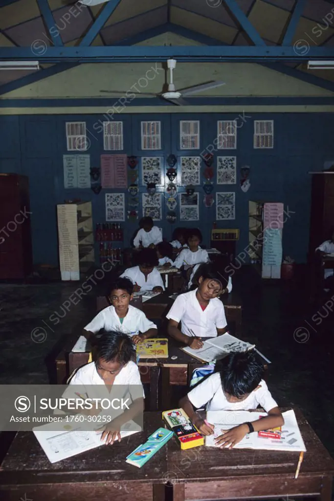 Malaysia, Tioman Island, children in classroom sitting at desks.