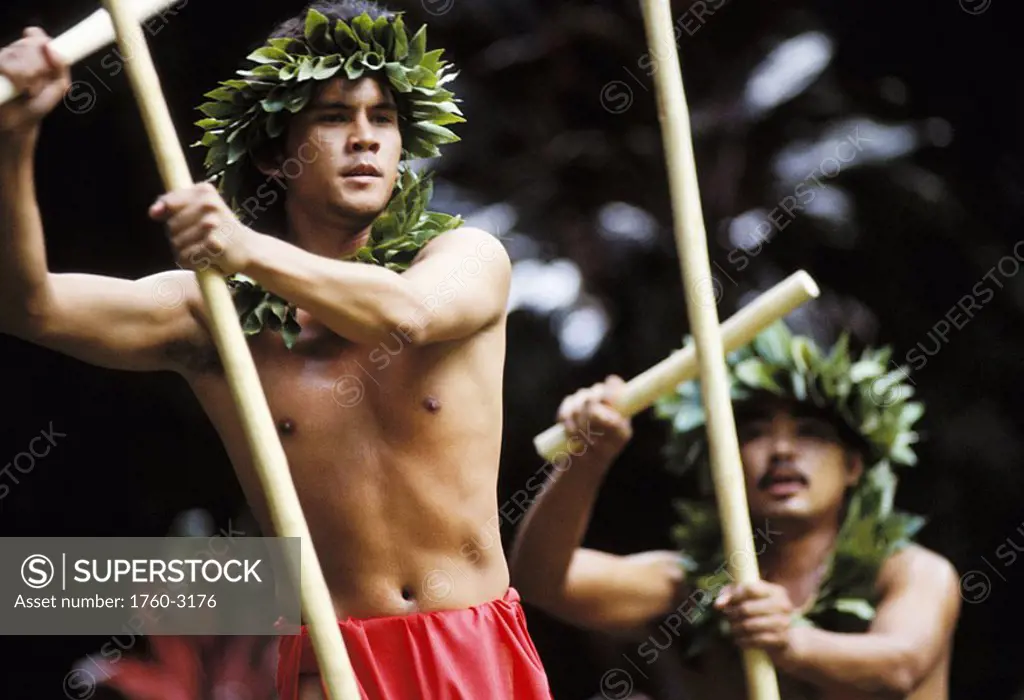 Hawaii, Oahu, Waimea Falls, Makahiki Festival, Male kahiko dancers with kaalau sticks