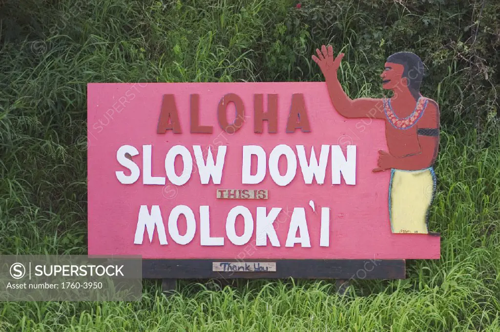 Hawaii, Molokai, Hoolehua, ´Aloha - Slow Down´ sign on airport road.