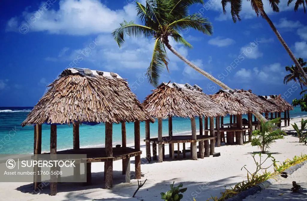 Western Samoa, view of samoan huts on white sandy beach