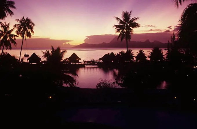 French Polynesia, Papeete, Tahiti Beachcomber Hotel silhouetted at sunset