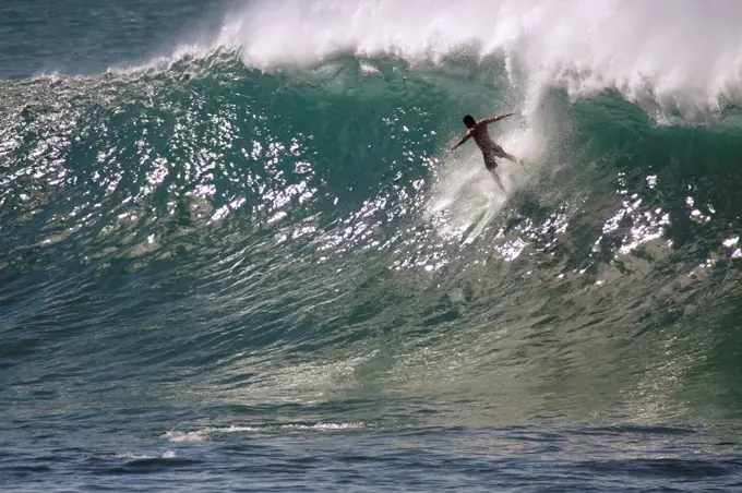 Hawaii, Waimea Bay, Man Surfing A Large Wave.