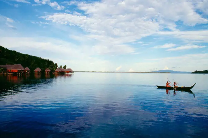 French Polynesia, Tahiti, Bora Bora, Couple canoe off Maara Beach