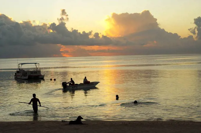 French Polynesia, Tahiti, Maupiti, lagoon sunset with water activities