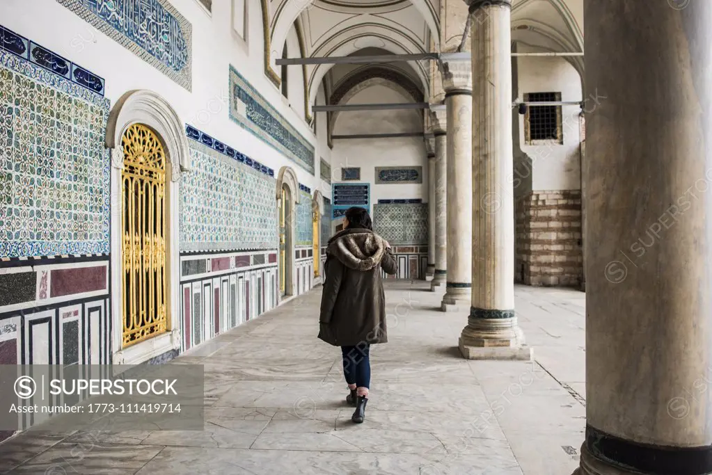 Woman exploring Topkapi Palace, Istanbul, Turkey