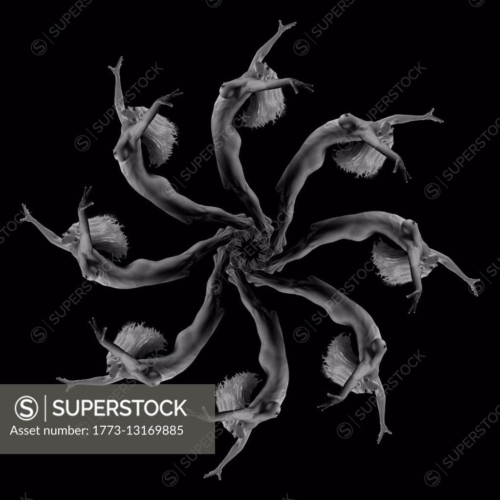 Multiple image kaleidoscope of nude mature woman against black background,  B&W - SuperStock