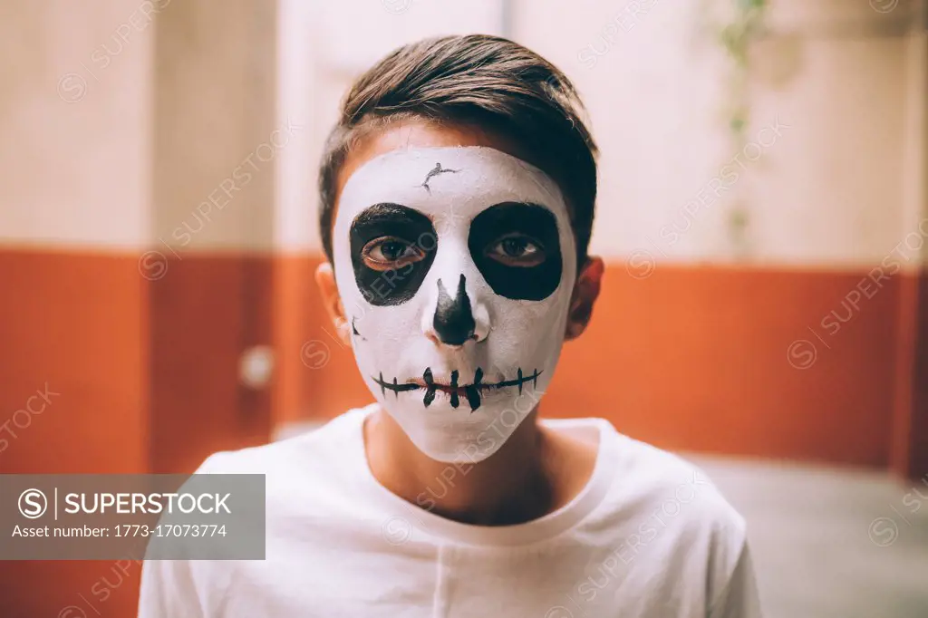 Boy with Halloween skull face paint