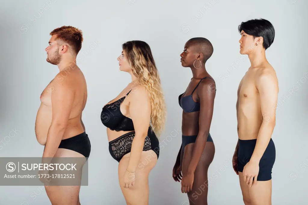 Young people wearing underwear, standing in a row