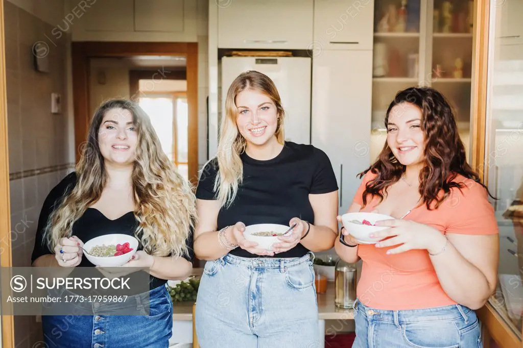 Three young women having breakfast together