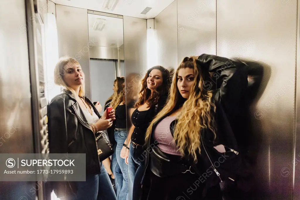 Three young women in elevator