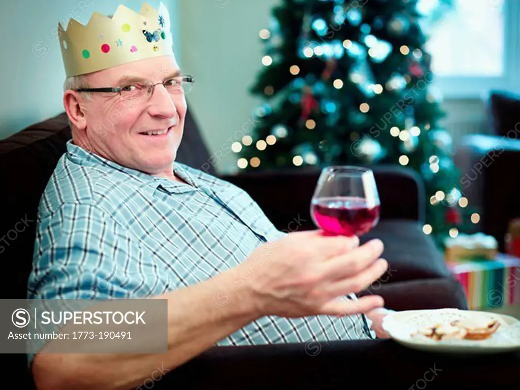 Senior man wearing christmas hat, portrait