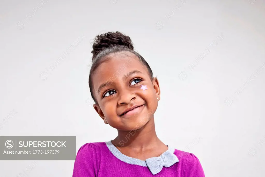 Portrait of a girl with star on her face