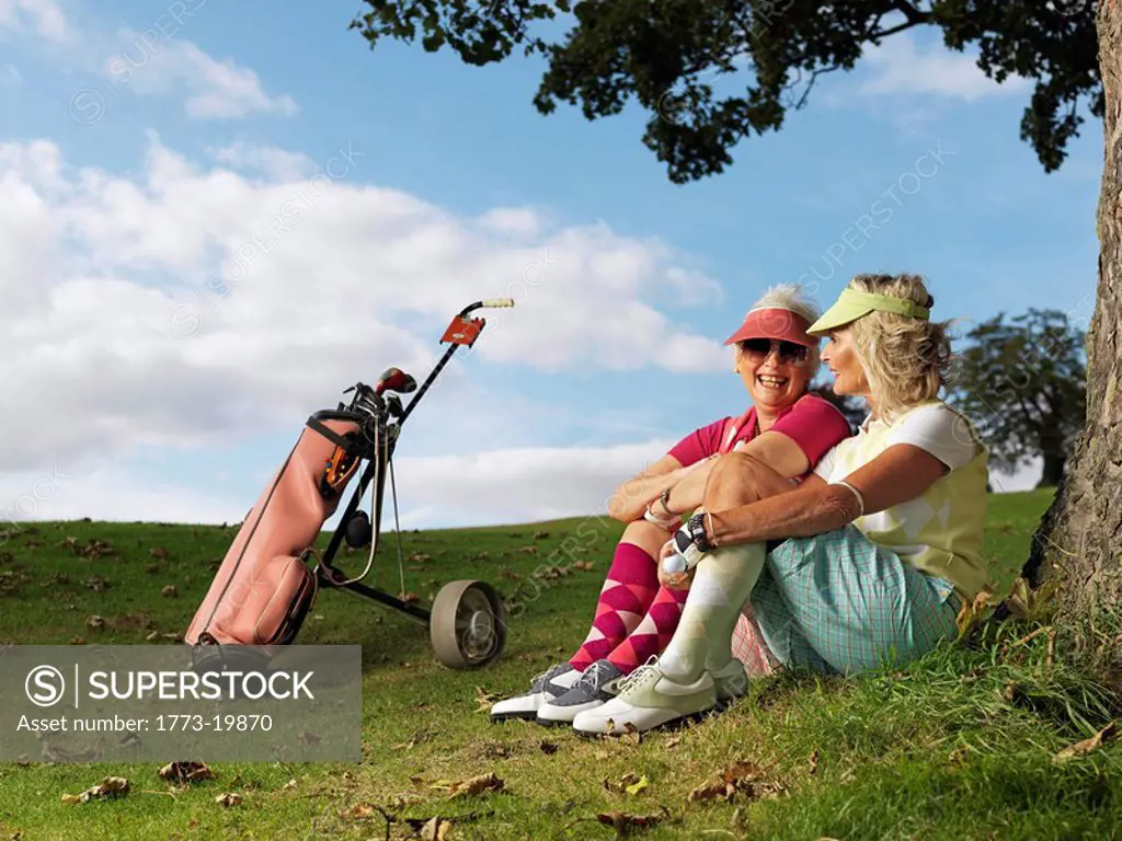 Mature ladies playing golf