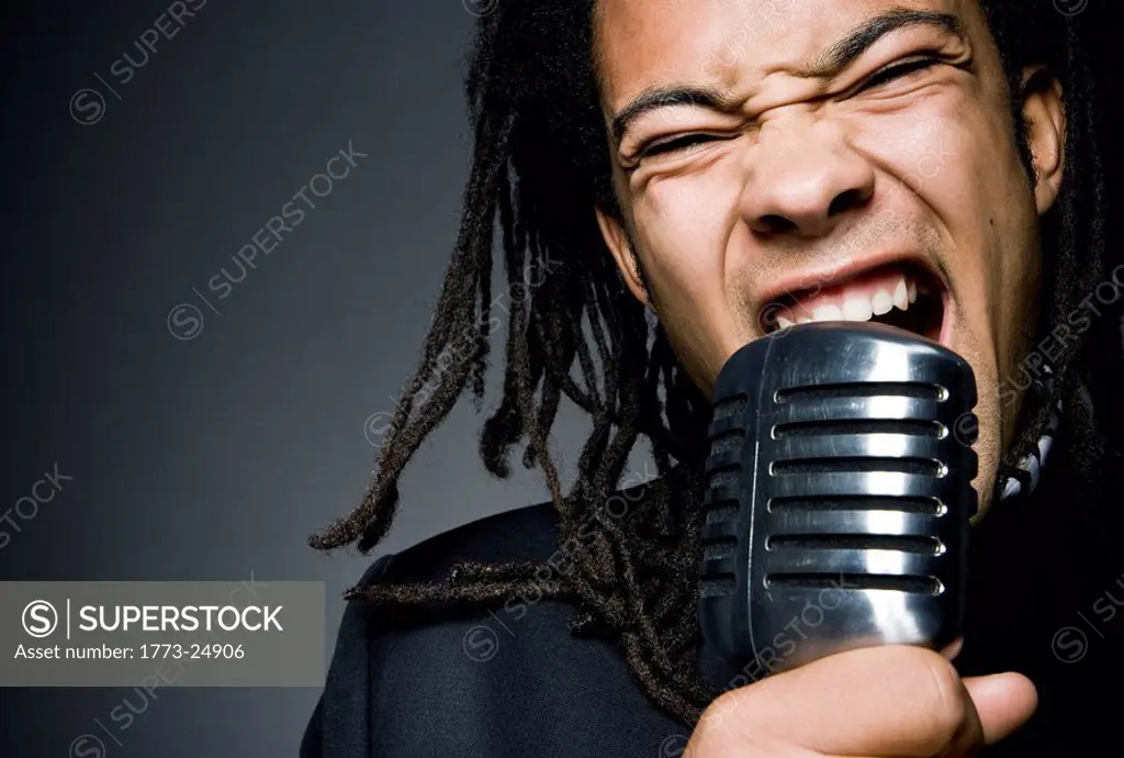 man shouting into mic close_up