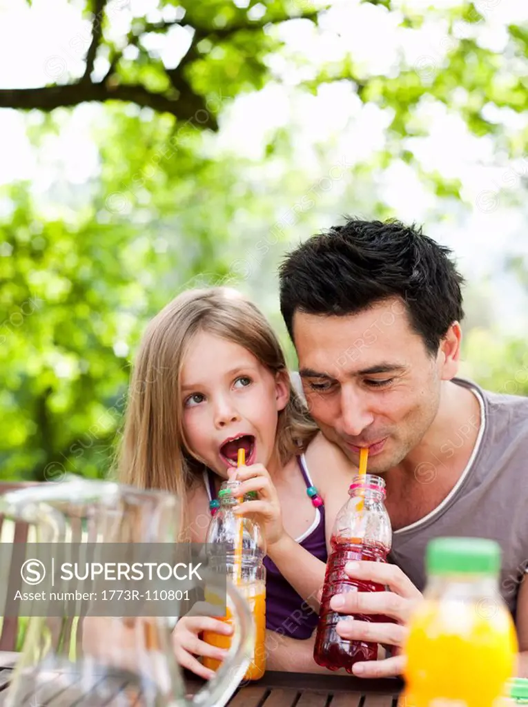 Father And Daughter Drinking