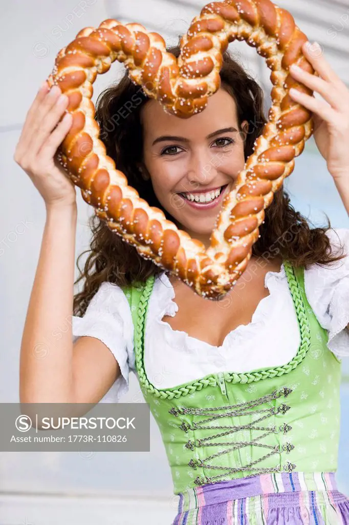 Young Woman With Pretzel Heard - SuperStock