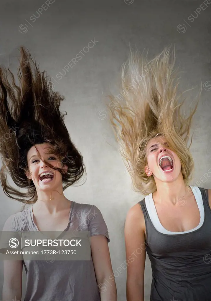 Teen girls laughing together