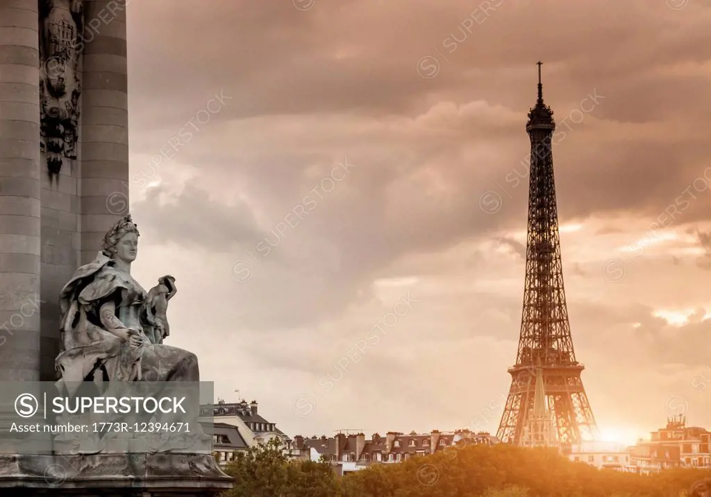 Sculpture on Pont Alexandre III bridge and Eiffel Tower, Paris, France