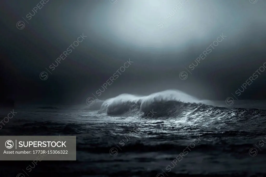 Giant waves breaking in the mist lighted by sun, Lahinch, Clare, Ireland