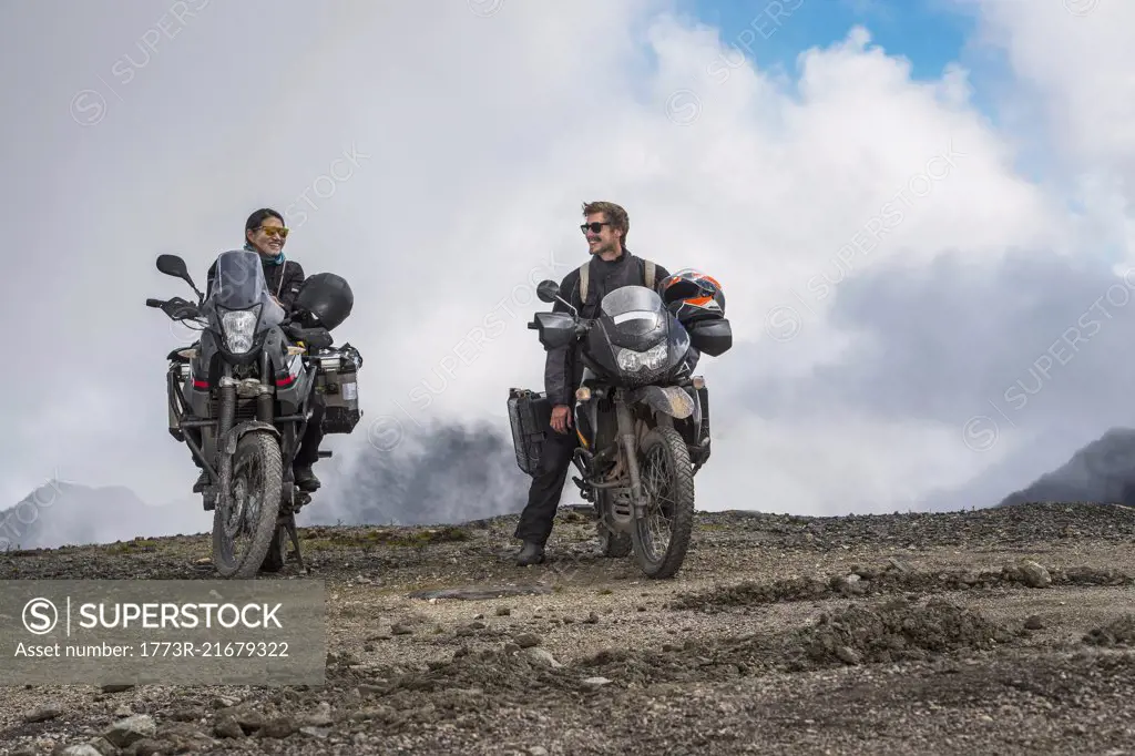 Couple on touring motorbikes at the pass of Abra de Malaga (4316 m.s.n.m.), Cusco, Peru, South America