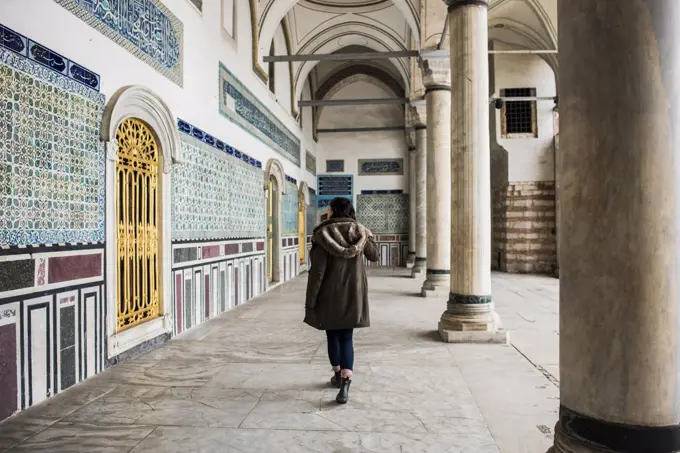 Woman exploring Topkapi Palace, Istanbul, Turkey