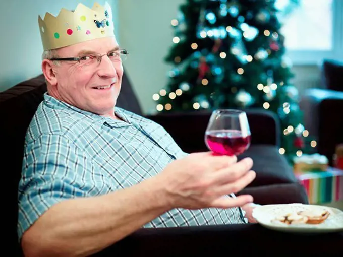 Senior man wearing christmas hat, portrait