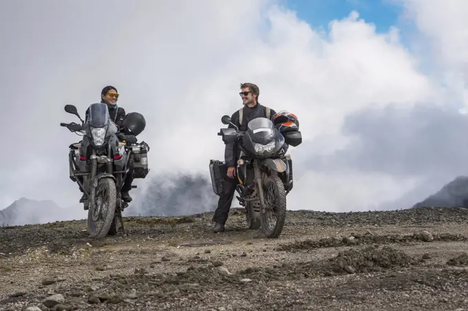 Couple on touring motorbikes at the pass of Abra de Malaga (4316 m.s.n.m.), Cusco, Peru, South America