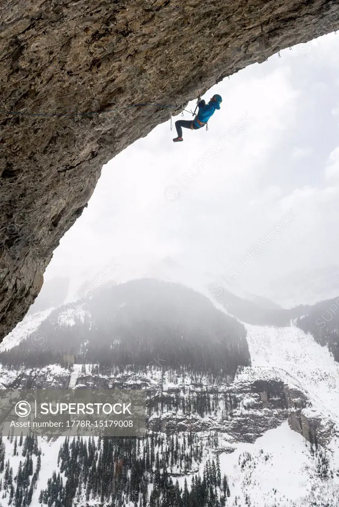 Man rock climbing overhanging cave route called Pull the Trigger Tigga at Hall of Justice, Camp Bird Road, Uncompahgre National Forest, Ouray, Colorad...