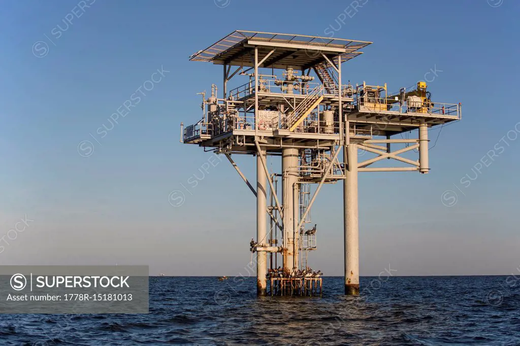 Oil platform against clear sky at dawn, Lake Charles, Louisiana, USA