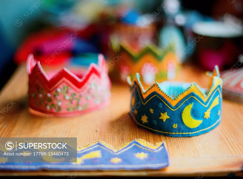 View of two handmade crowns on table made for child's birthday