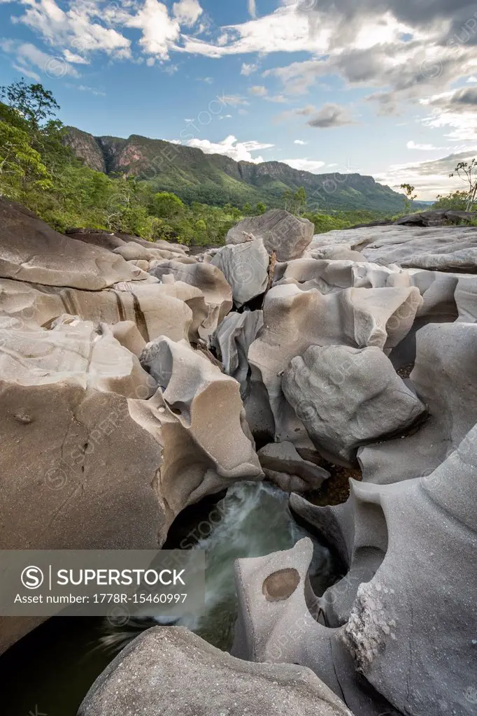 Beautiful landscape with river running among rocks in Vale da Lua Moon Valley, Chapada dos Veadeiros, Goias, Brazil