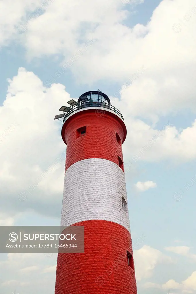 Exterior of red and white lighthouse against sky, Vizhinjam, Kerala, India