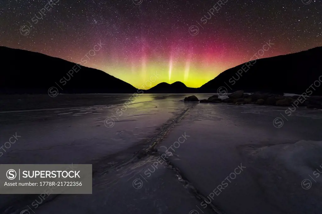 The Northern Lights over frozen Jordan Pond in Acadia National Park.