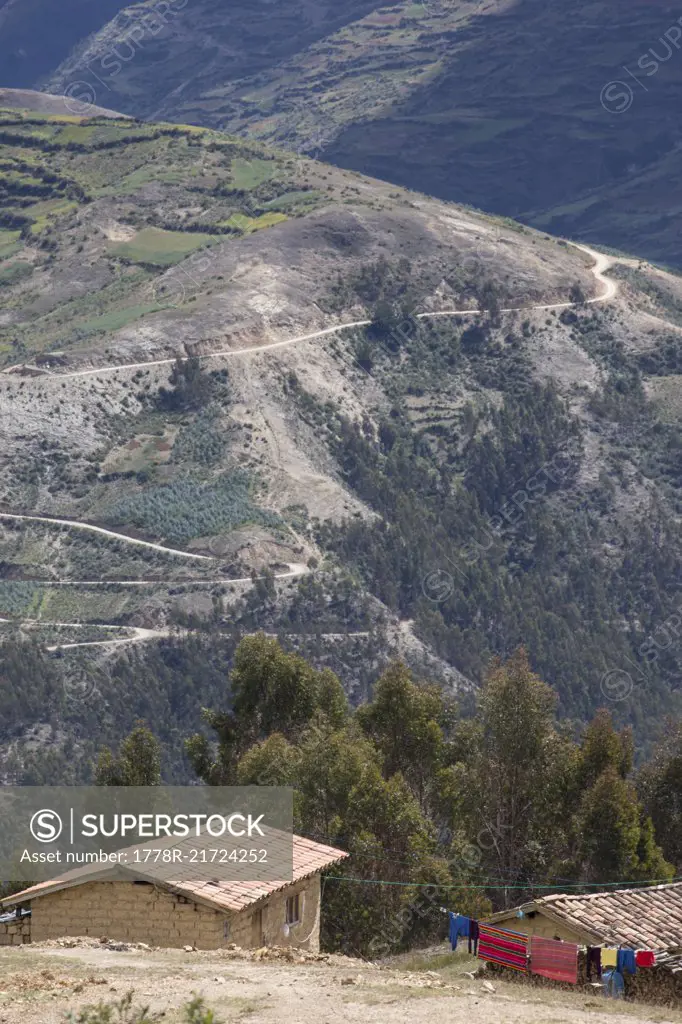 Photograph with rural houses and mountains of Peruvian Andes, Peru