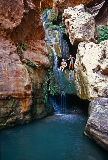 man and woman in lush desert canyon, Grand Canyon, Arizona