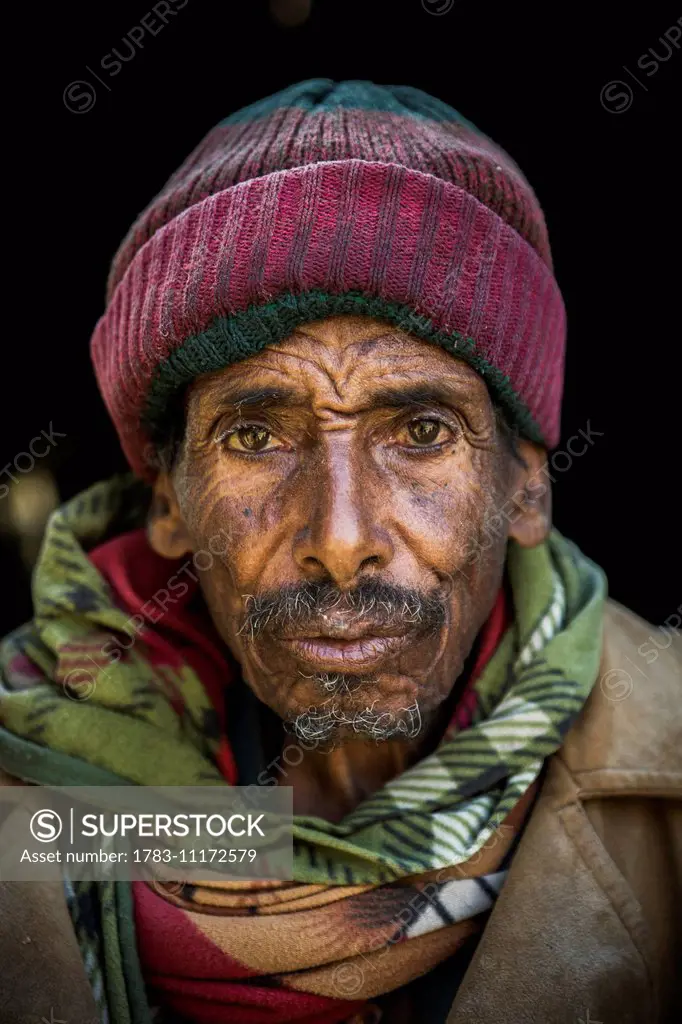 Portrait of a man running a flour mill; Ethiopia