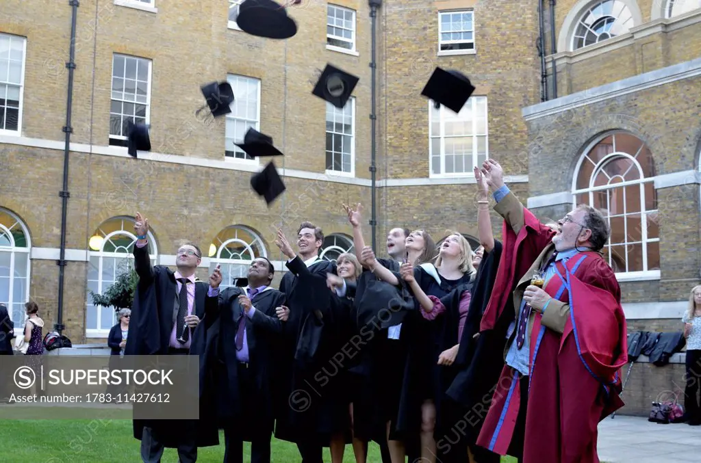 Graduands Throwing Hats In The Air, University College London, London, Uk