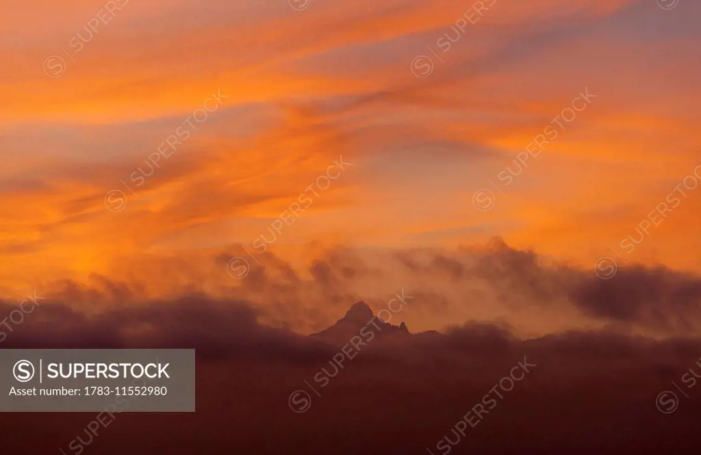 Mt Kenya coming out from clouds at dawn, Ol Pejeta Conservancy; Kenya