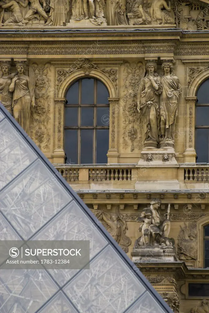 Detail of the pyramid and the Louvre Museum., Louvre Museum (Musee du Louvre), Paris, France.