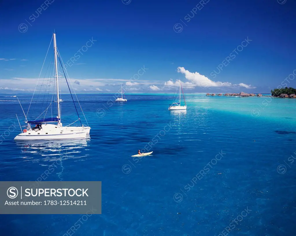 Boats moored off the coast of Tahiti; Tahiti