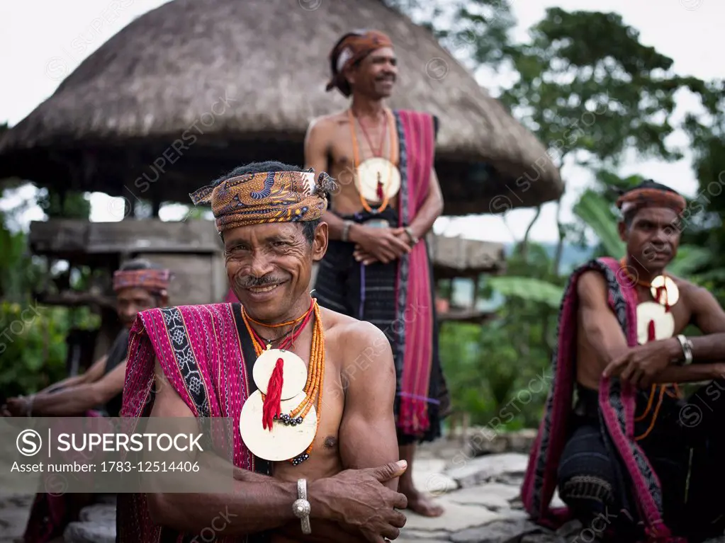 Timorese men in traditional attire at Liurai Village; Timor-Leste