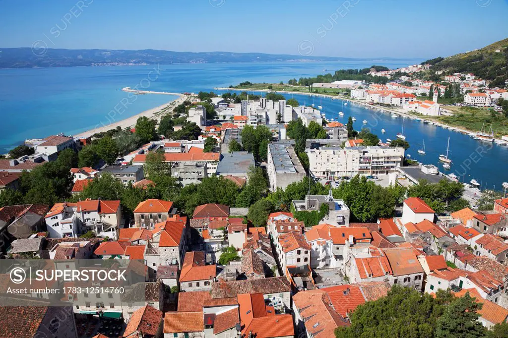 Red rooftops and view of the Dalmatian Coast; Omis, Split-Dalmatia, Croatia