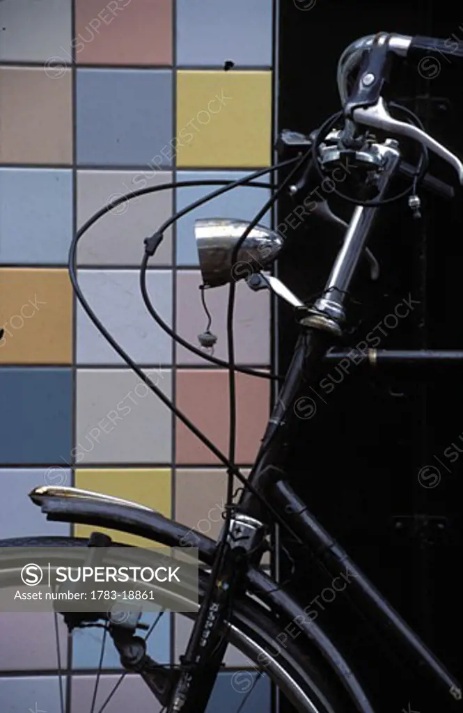 Bicycle and tiled wall in Amsterdam, Amsterdam, Netherlands