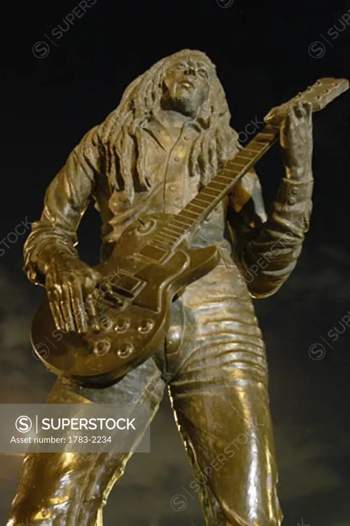 Bob Marley statue at night outside the National Stadium, Kingston, Jamaica. 