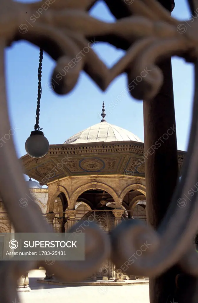 View through a gate of a fountain in Muhammad Ali Mosque courtyard, Citadel, Cairo, Egypt