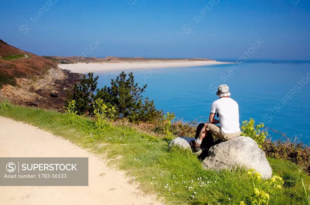 England, Channel Islands, Tourist on Shell Beach; Herm