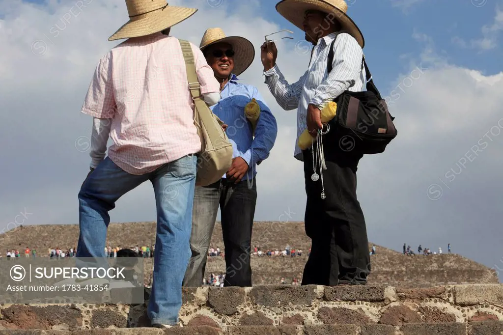 near Mexico city; Mexico, Teotihuacan archeological site, Hawkers with souvenirs on steps of Pyramid of the Sun